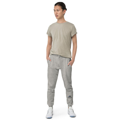 Person wearing a gray t-shirt and gray jogger pants on a white background