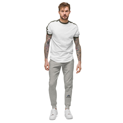 Man wearing a white t-shirt and gray jogger pants on a white background
