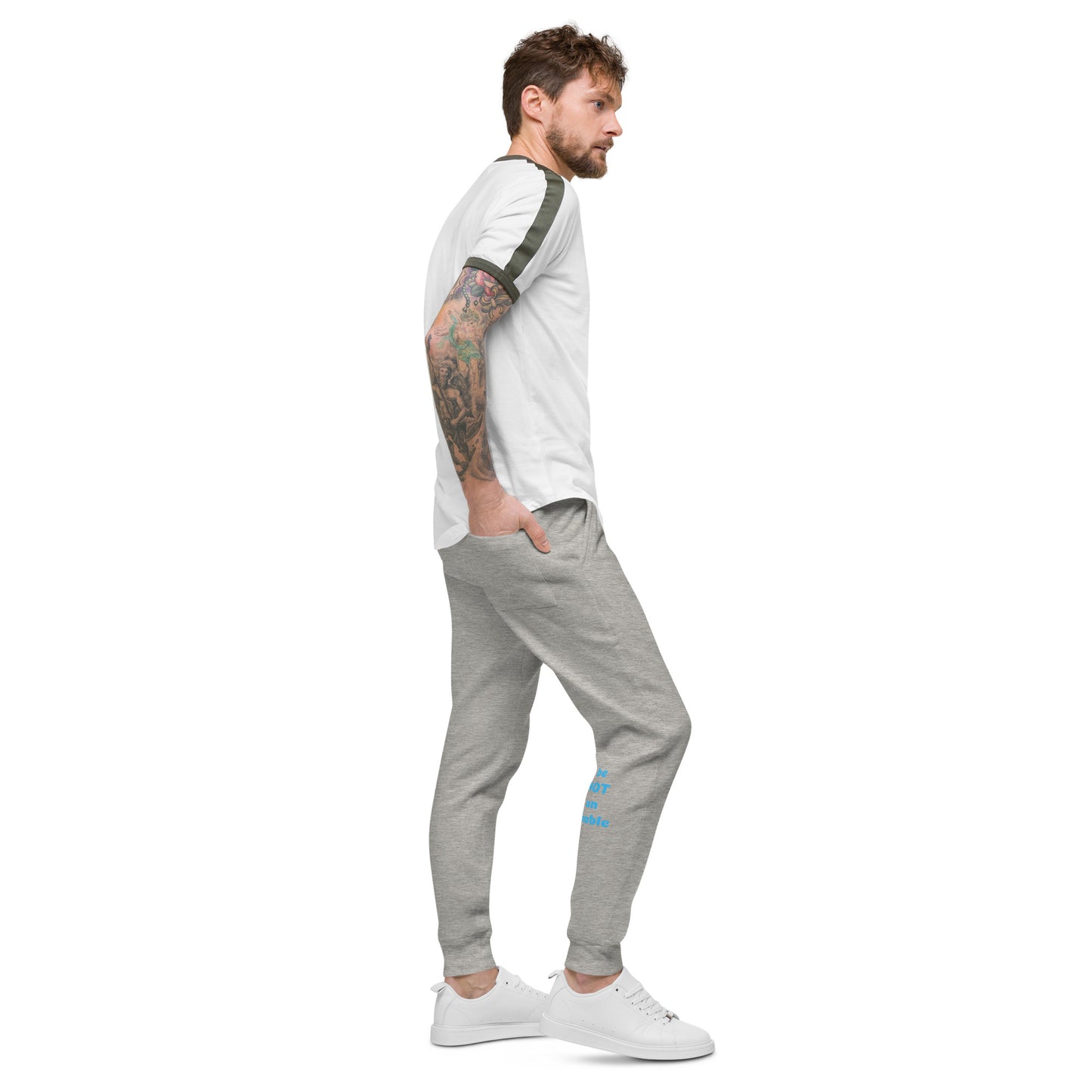 Man wearing a white t-shirt and gray sweatpants on a white background
