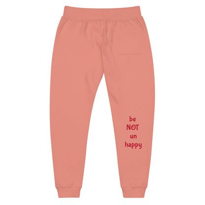 rose pink sweatpants with red text 'be NOT un happy' on a white background