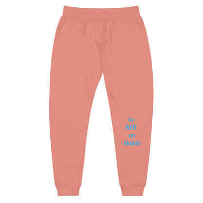 rose pink sweatpants with blue text on a white background