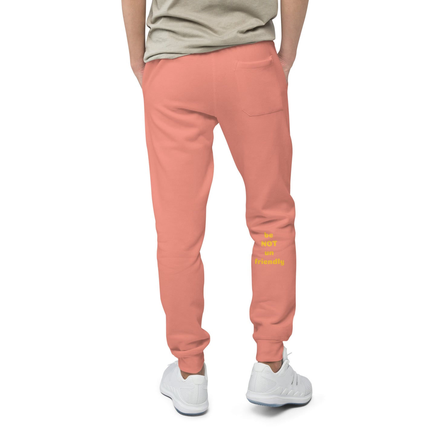 Person wearing rose pink sweatpants with text on a white background