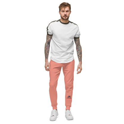 Man wearing a white t-shirt and rose pink pants on a white background