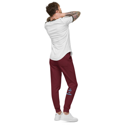 Man wearing a white t-shirt and maroon pants with text on a white background