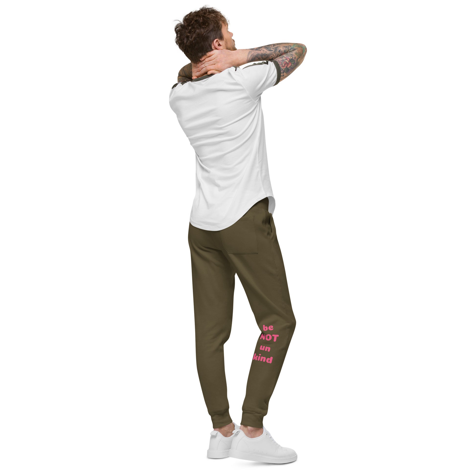 Man wearing a white t-shirt and military green jogger pants with text on a white background