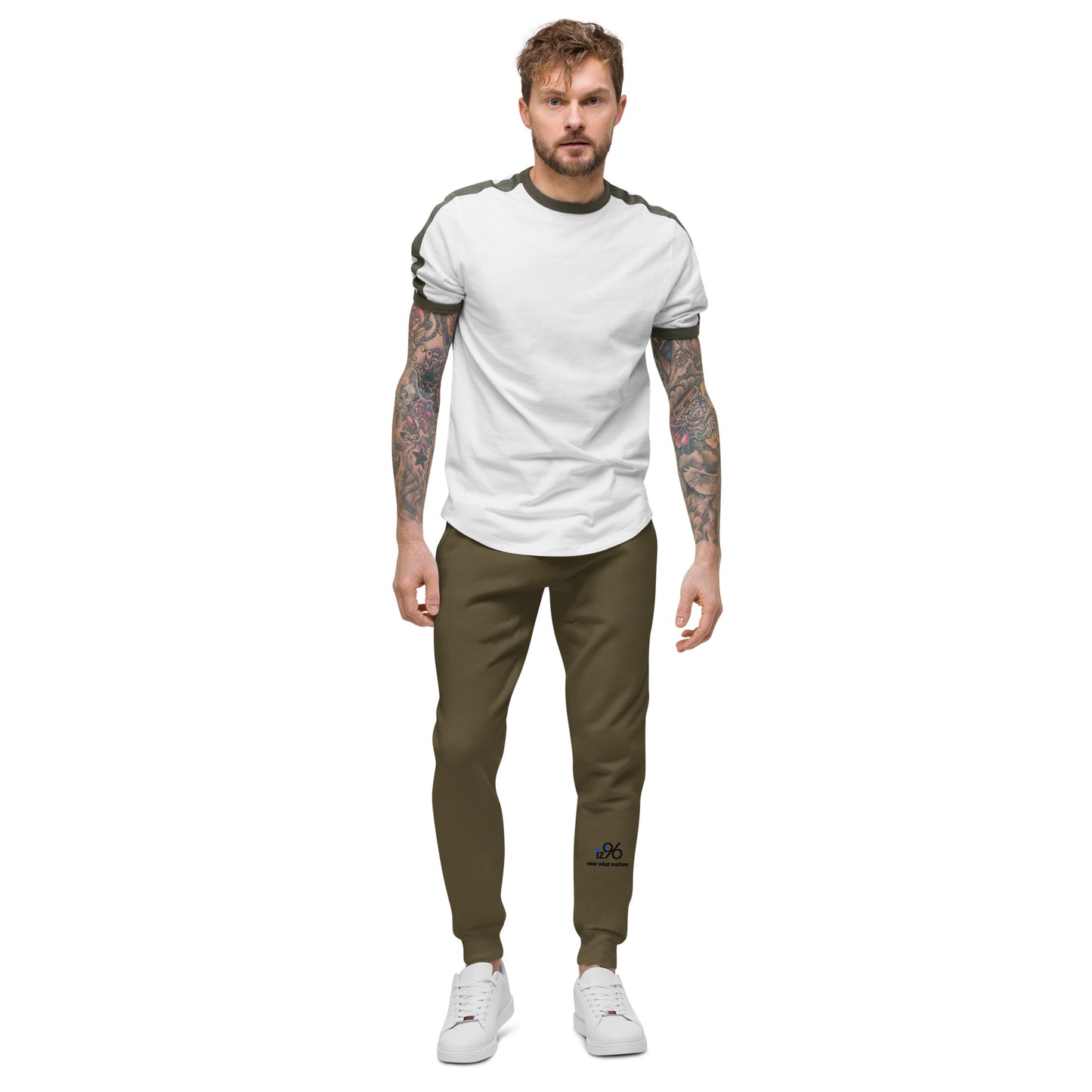 Man wearing a white t-shirt and military green pants on a white background