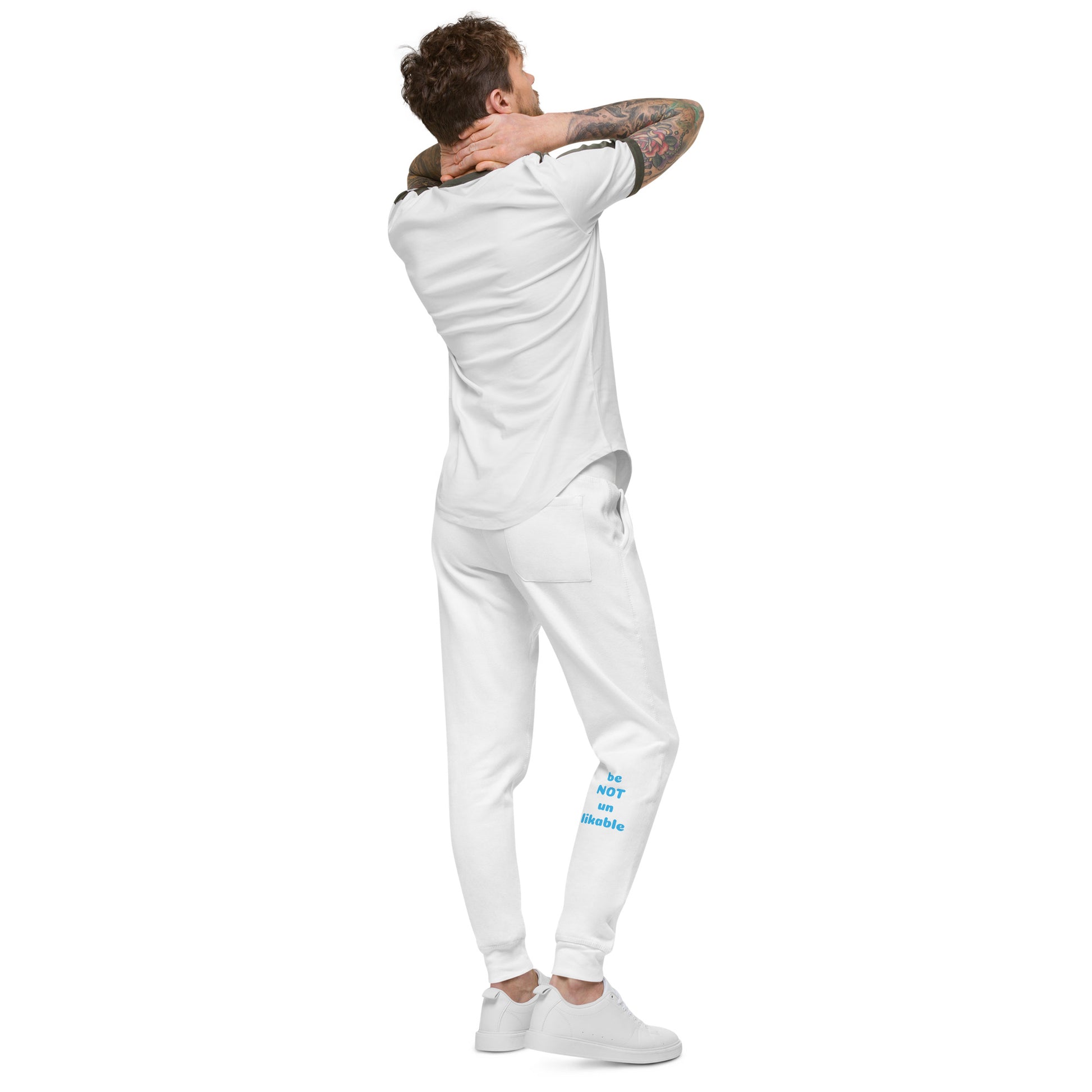 Man wearing a white outfit on a white background