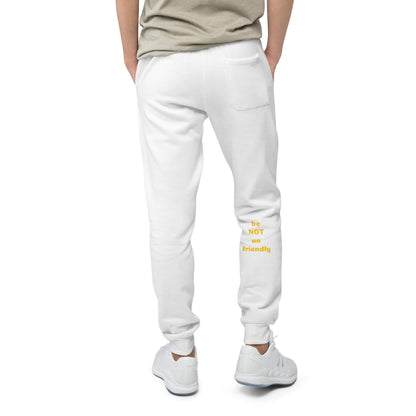 White sweatpants with yellow text worn by a person on a white background