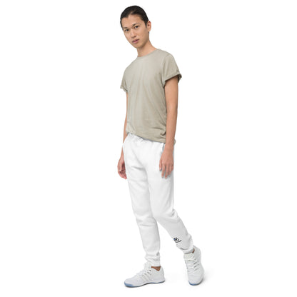 Person wearing a beige t-shirt and white pants on a white background