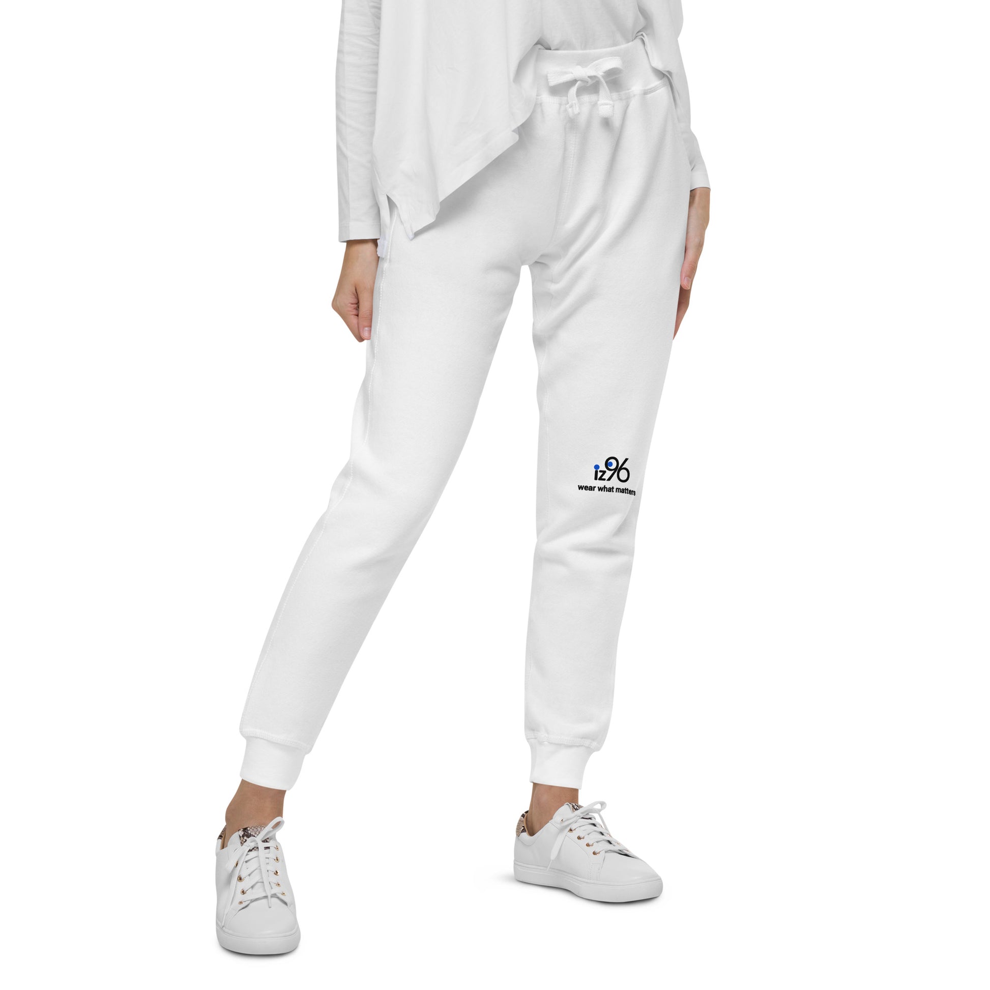 hite jogger pants with a logo on a white background