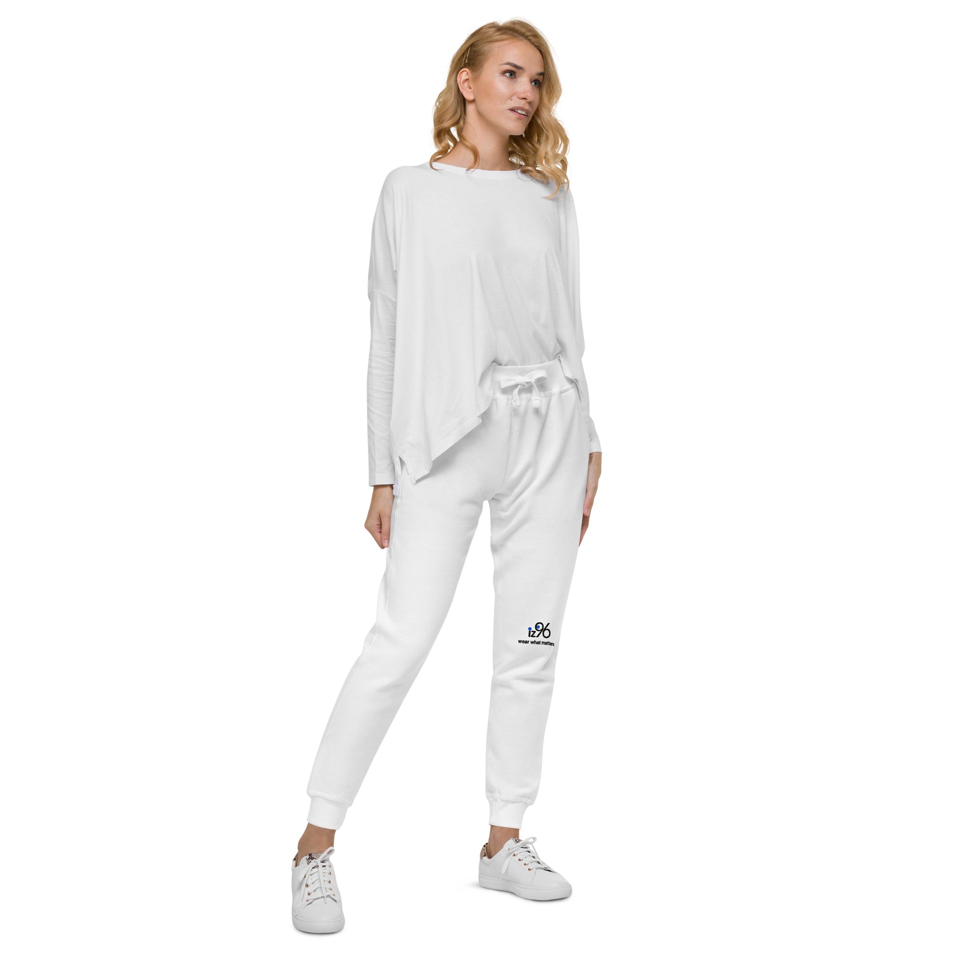 Woman wearing a white tracksuit with a logo on a white background