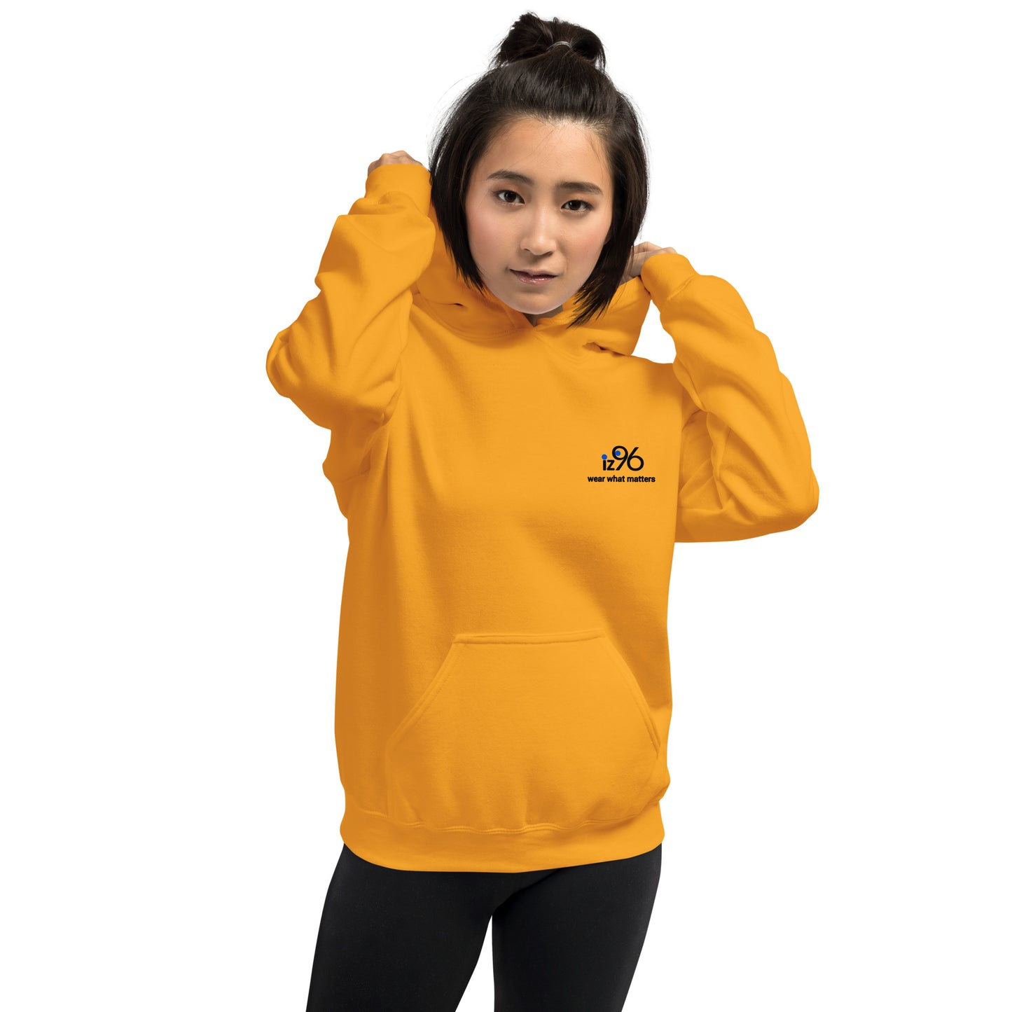 Person wearing a yellow gold hoodie with a logo on a white background