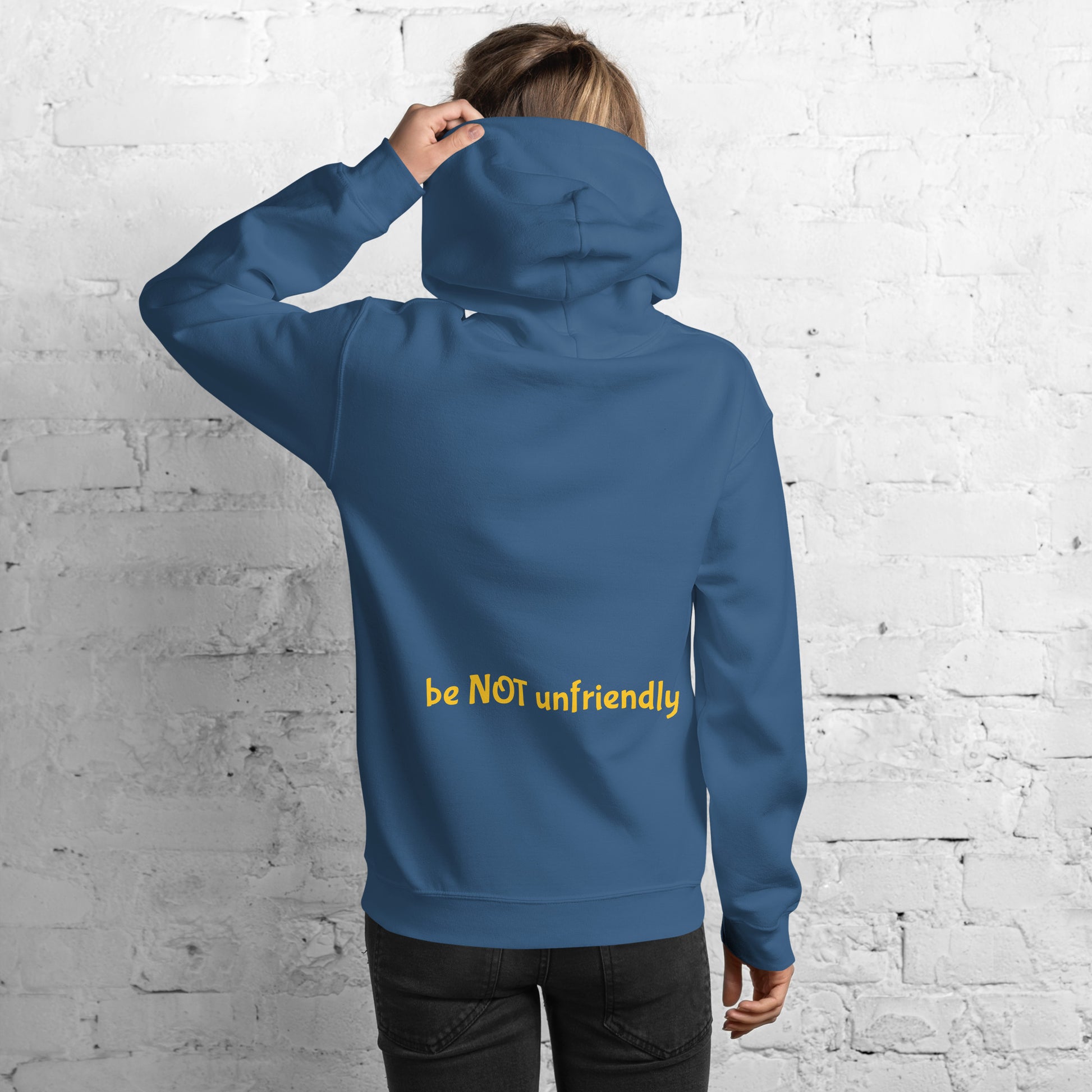 Person wearing a blue hooded sweat shirt with 'be not unfriendly' text on a white background