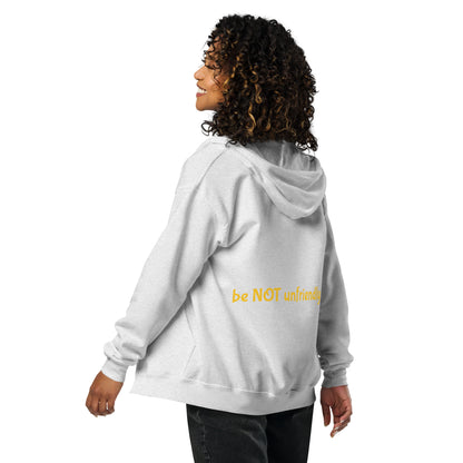 Person wearing a light gray hoodie on a white background