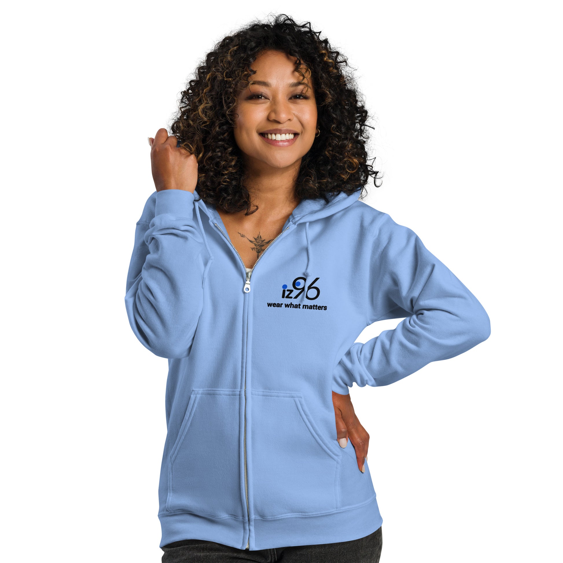 Woman wearing a light blue hoodie with a logo on a white background