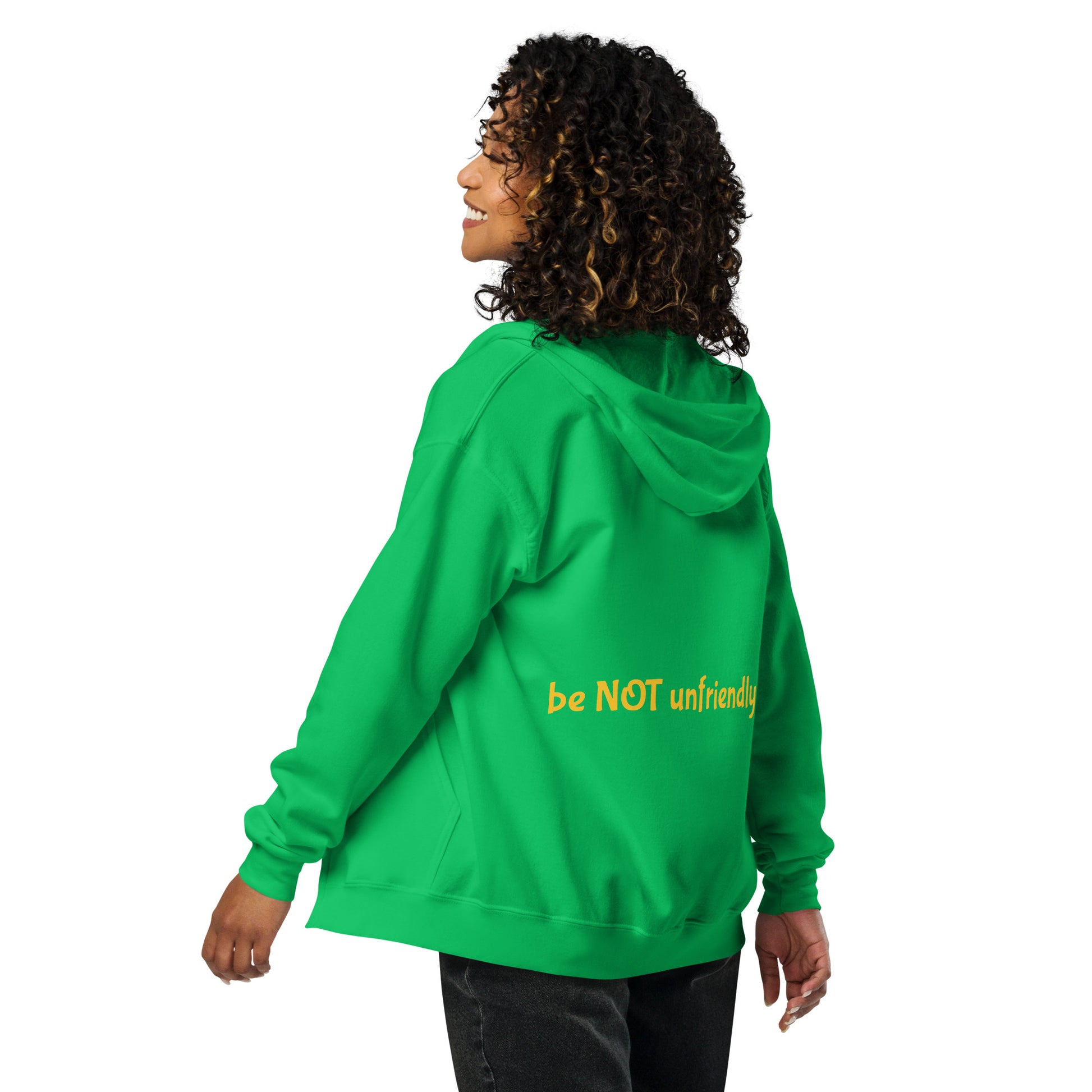 Person wearing a green hoodie with 'be NOT unfriendly' text on the back, on a white background