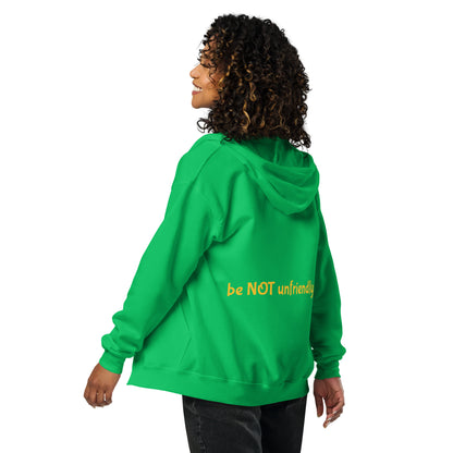 Person wearing a green hoodie with 'be NOT unfriendly' text on the back, on a white background