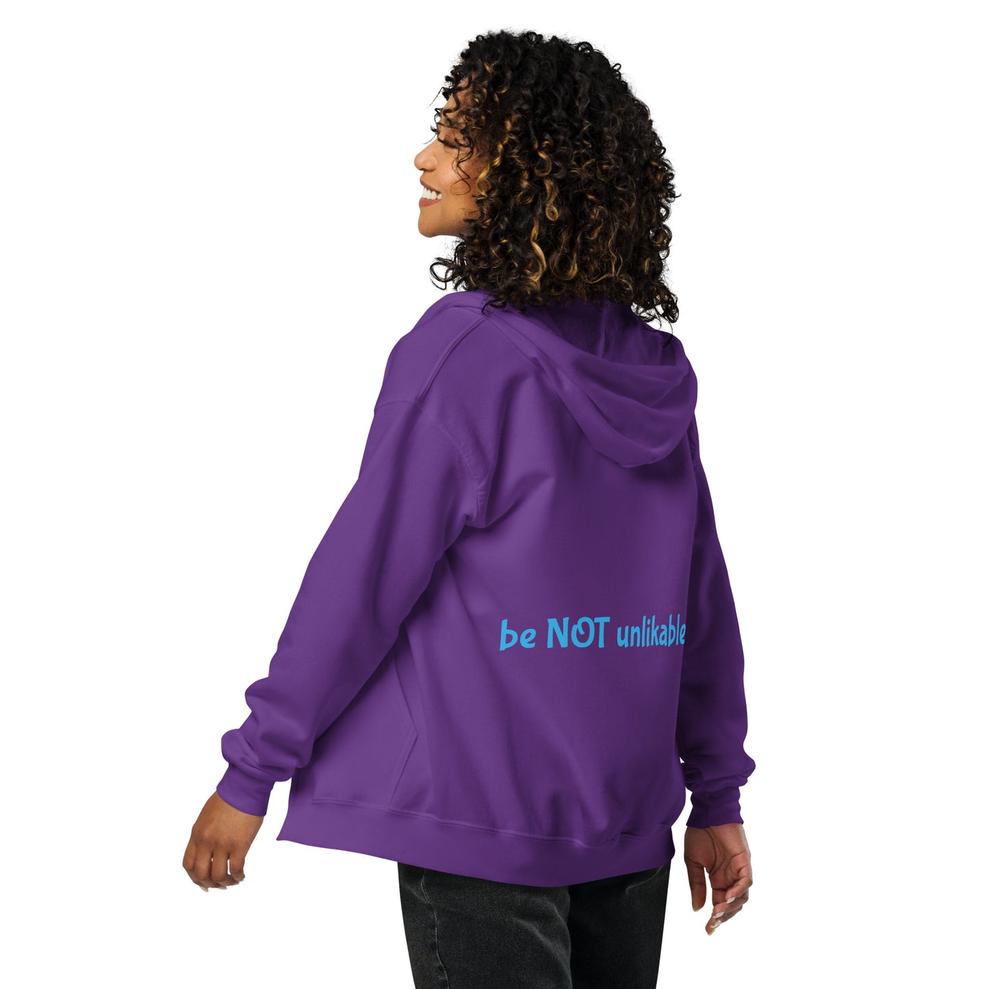 Person wearing a purple hoodie with 'be NOT unlikable' text on the back, on a white background