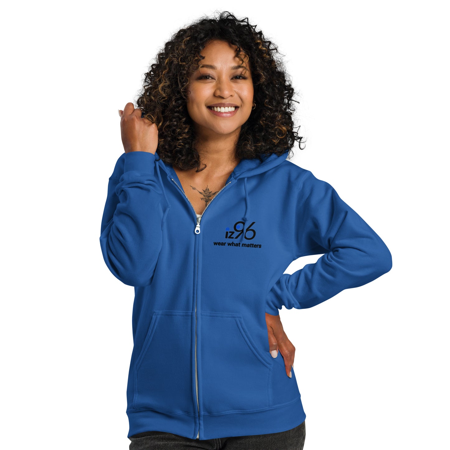 Woman wearing a blue hoodie with a small graphic on a white background