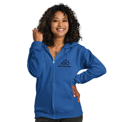 Woman wearing a blue hoodie with a small graphic on a white background