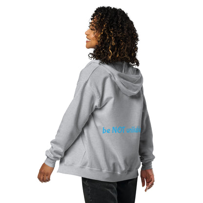 Person wearing a gray hoodie on a white background