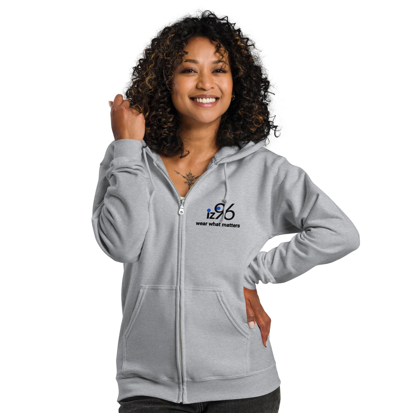 Woman wearing a gray hoodie with a logo on a white background
