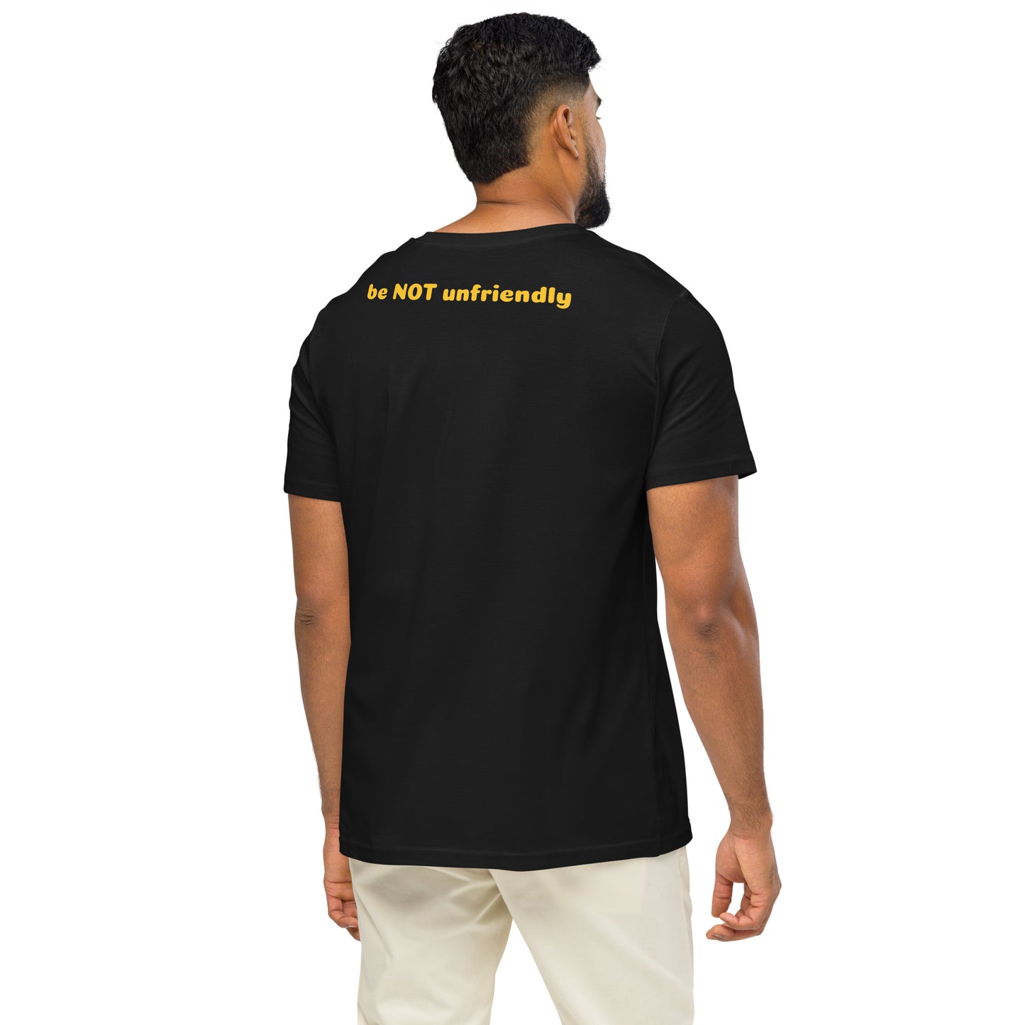 Man wearing a black t-shirt with yellow text on the back, standing against a white background
