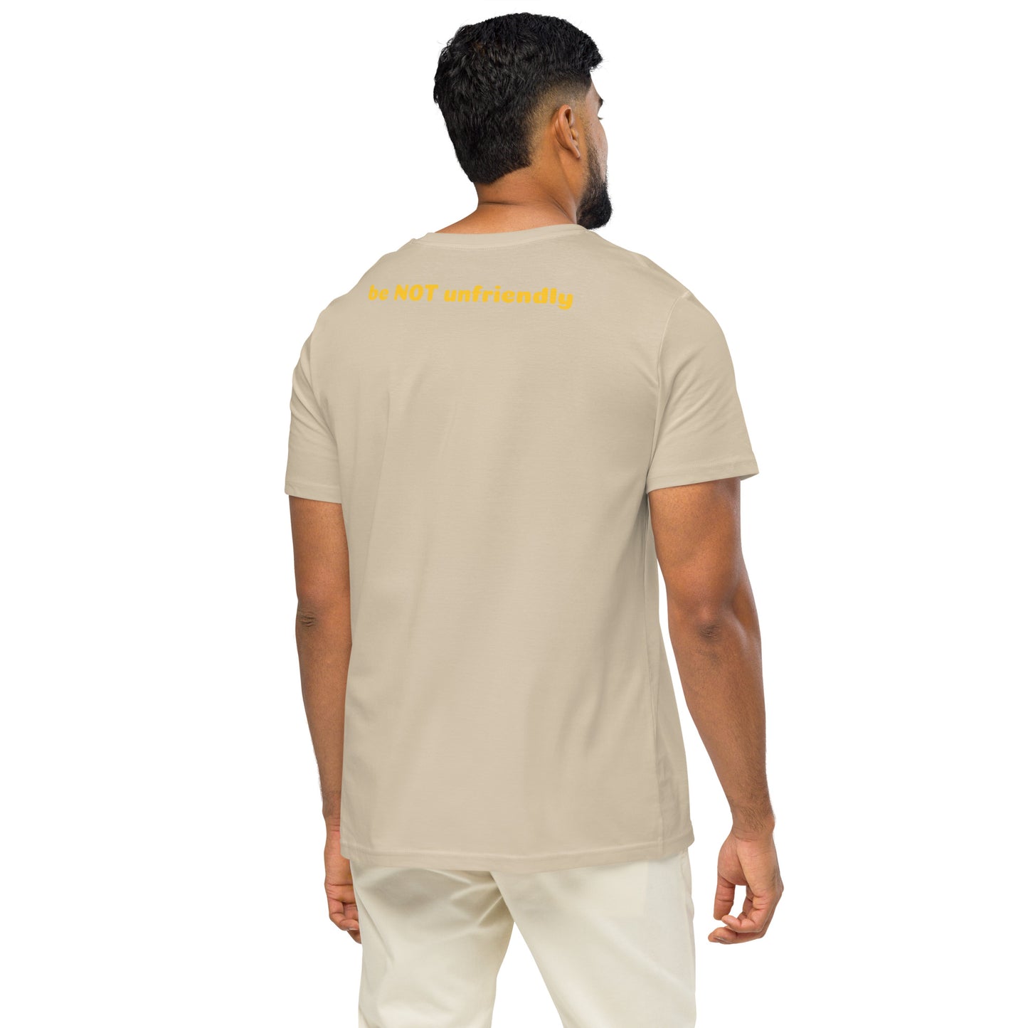 Man wearing a beige t-shirt and white pants on a white background