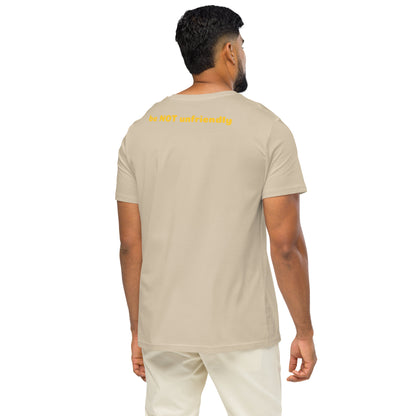 Man wearing a beige t-shirt and white pants on a white background