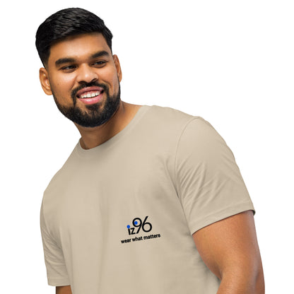 Man wearing a beige t-shirt with a logo and text on a white background