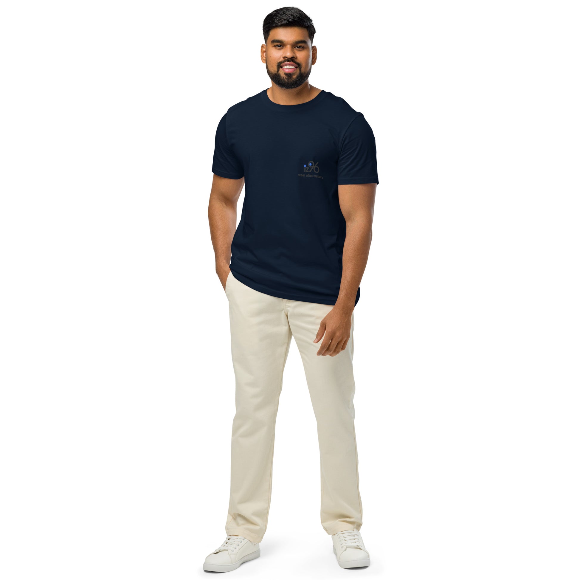 Man wearing a black t-shirt and beige pants on a white background
