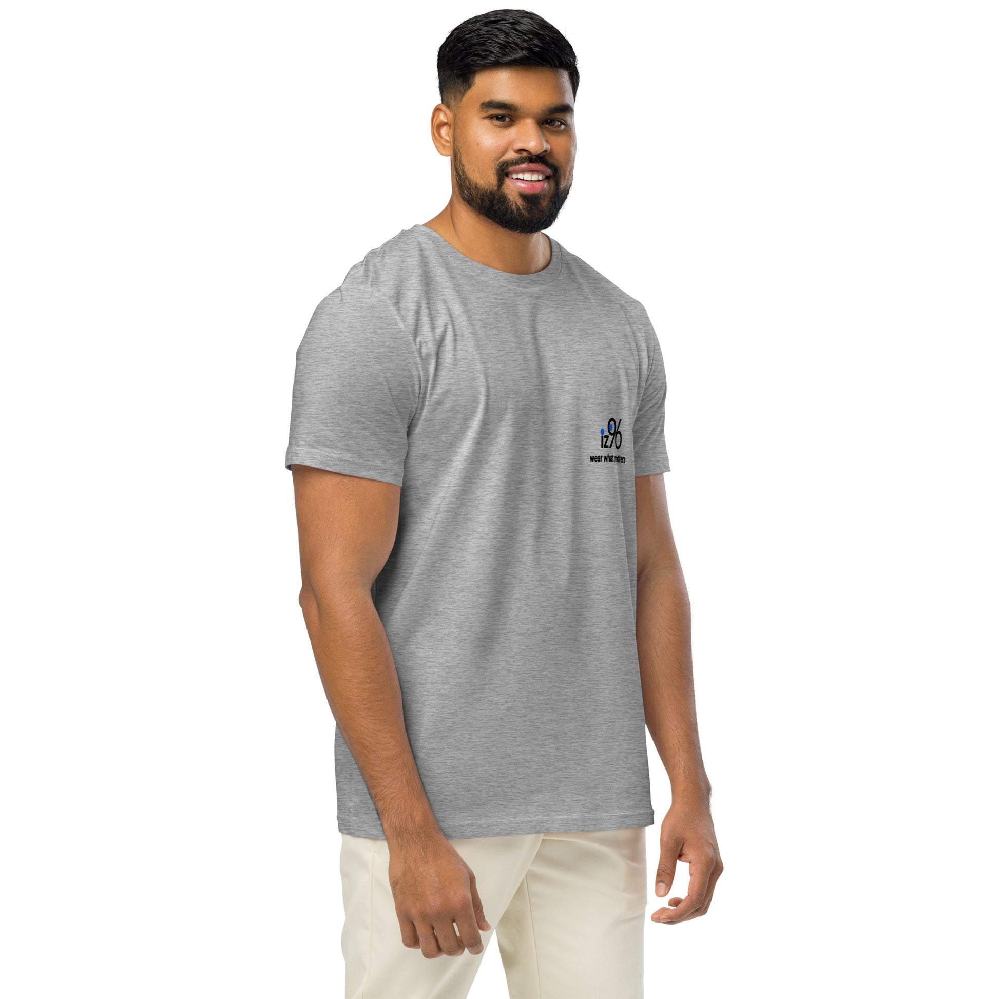 Man wearing a gray t-shirt with a logo on a white background