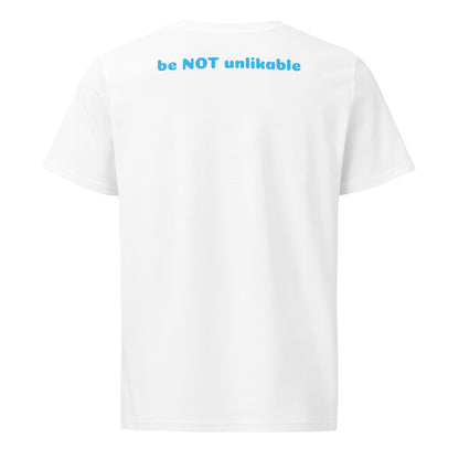 White t-shirt with blue text 'be NOT unlikable' on a white background