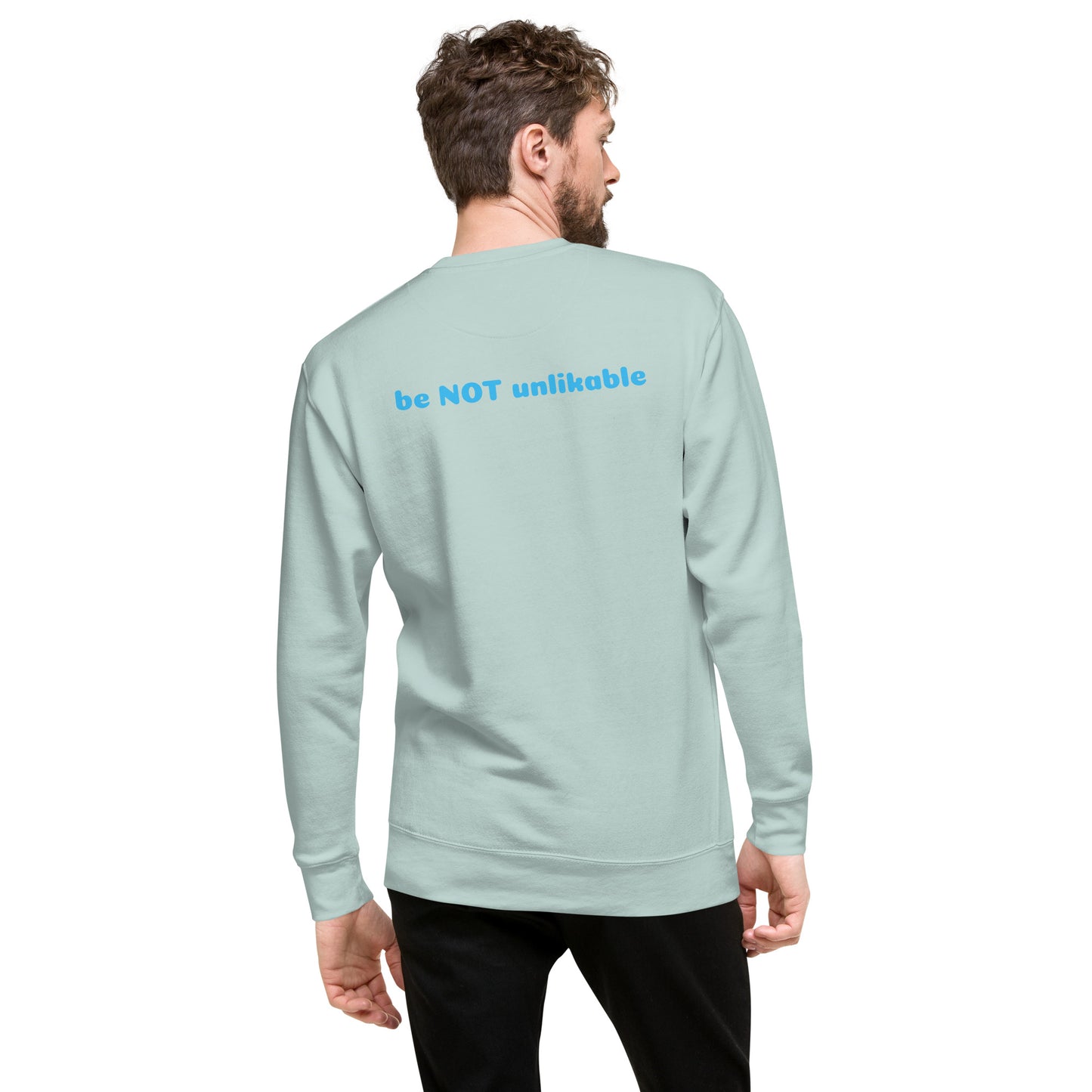 Man wearing a light blue sweatshirt with a text design on a white background