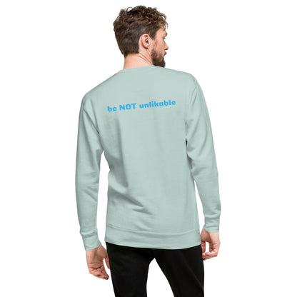 Man wearing a light blue sweatshirt with a text design on a white background
