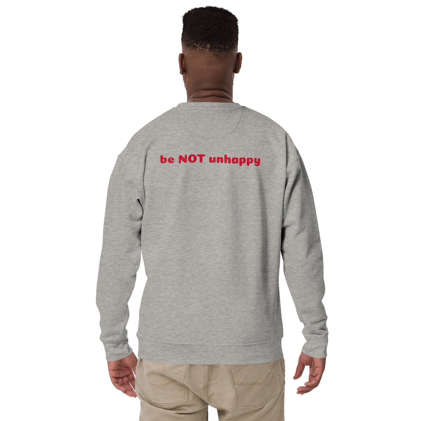 Person wearing a gray sweatshirt with 'be NOT unhappy' text on the back, standing against a white background.
