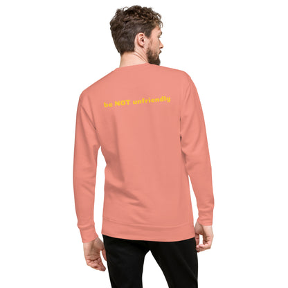 Person wearing a rose pink sweatshirt with text on the back against a white background