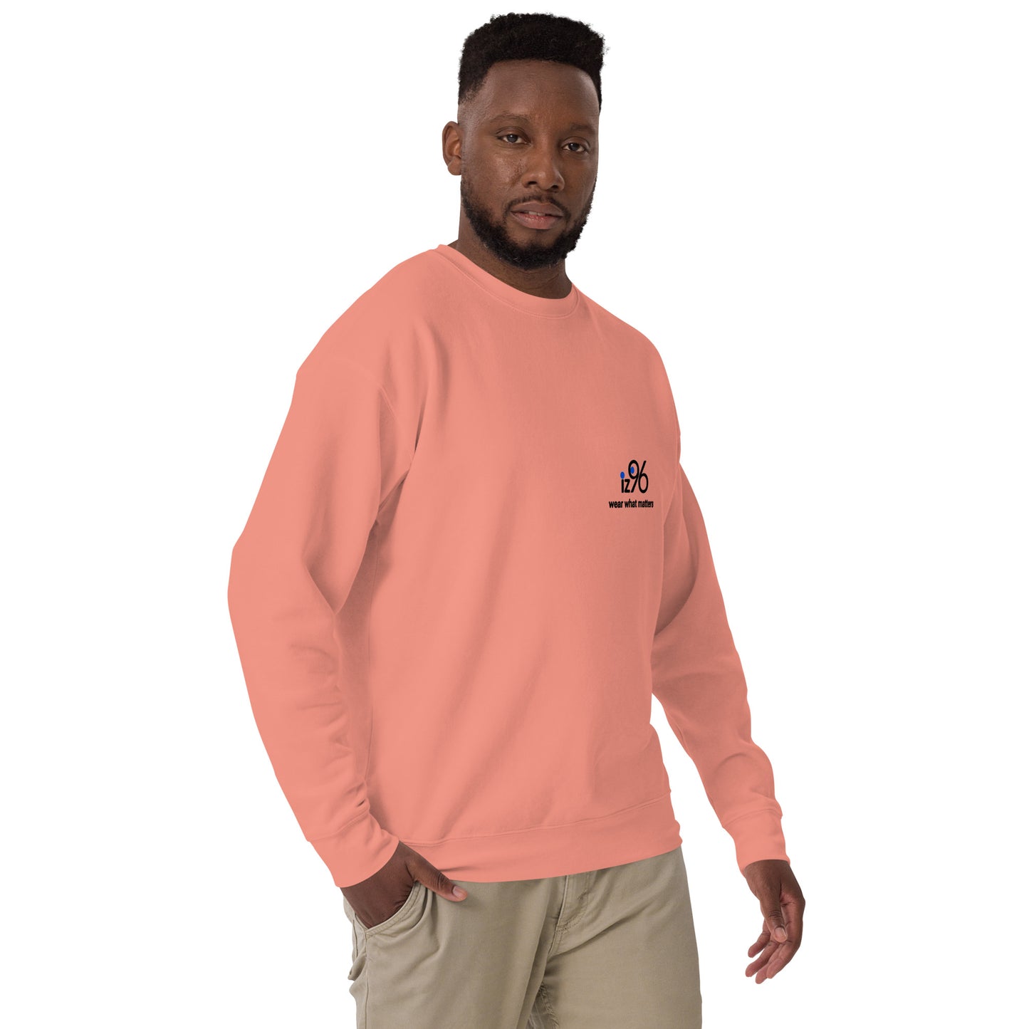 Man wearing a rose pink sweatshirt with logo on a white background