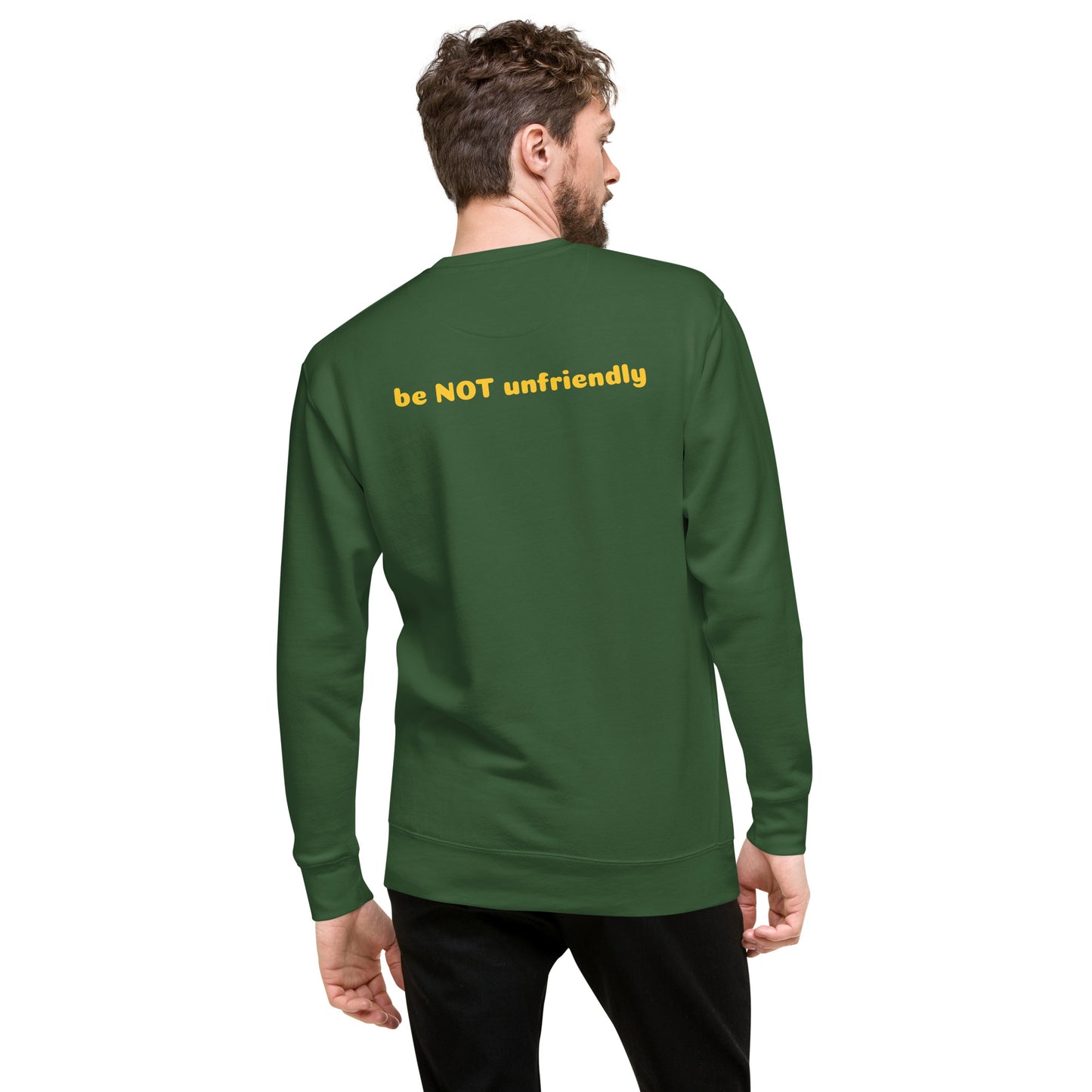Man wearing a forest green sweatshirt with text on the back against a white background