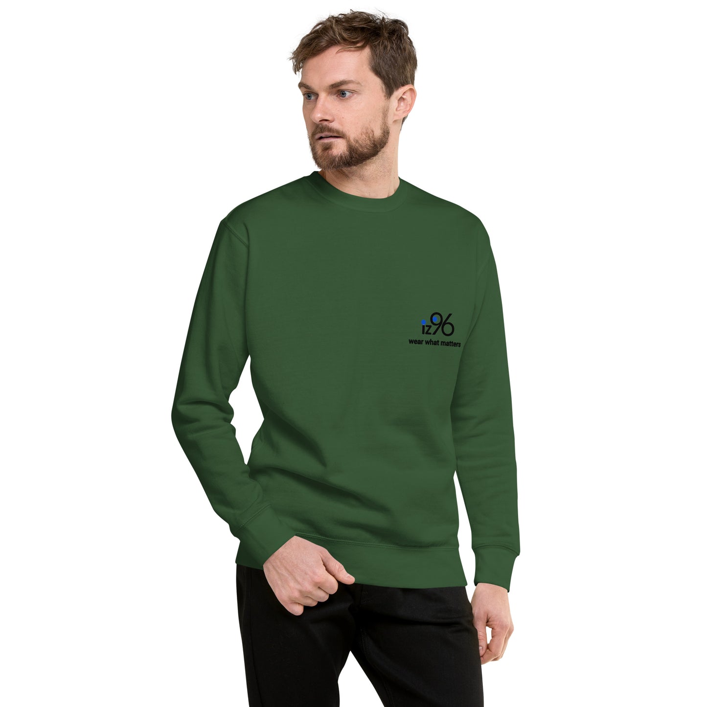 Man wearing a forest green sweater on a white background