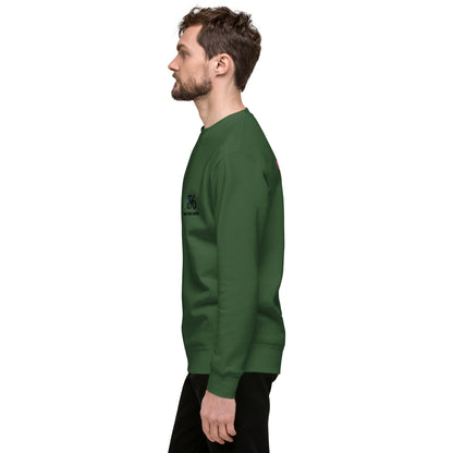 Man wearing a green sweatshirt with a logo against a white background