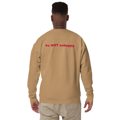 Person wearing a khaki sweatshirt with 'be NOT unhappy' text on the back, on a white background