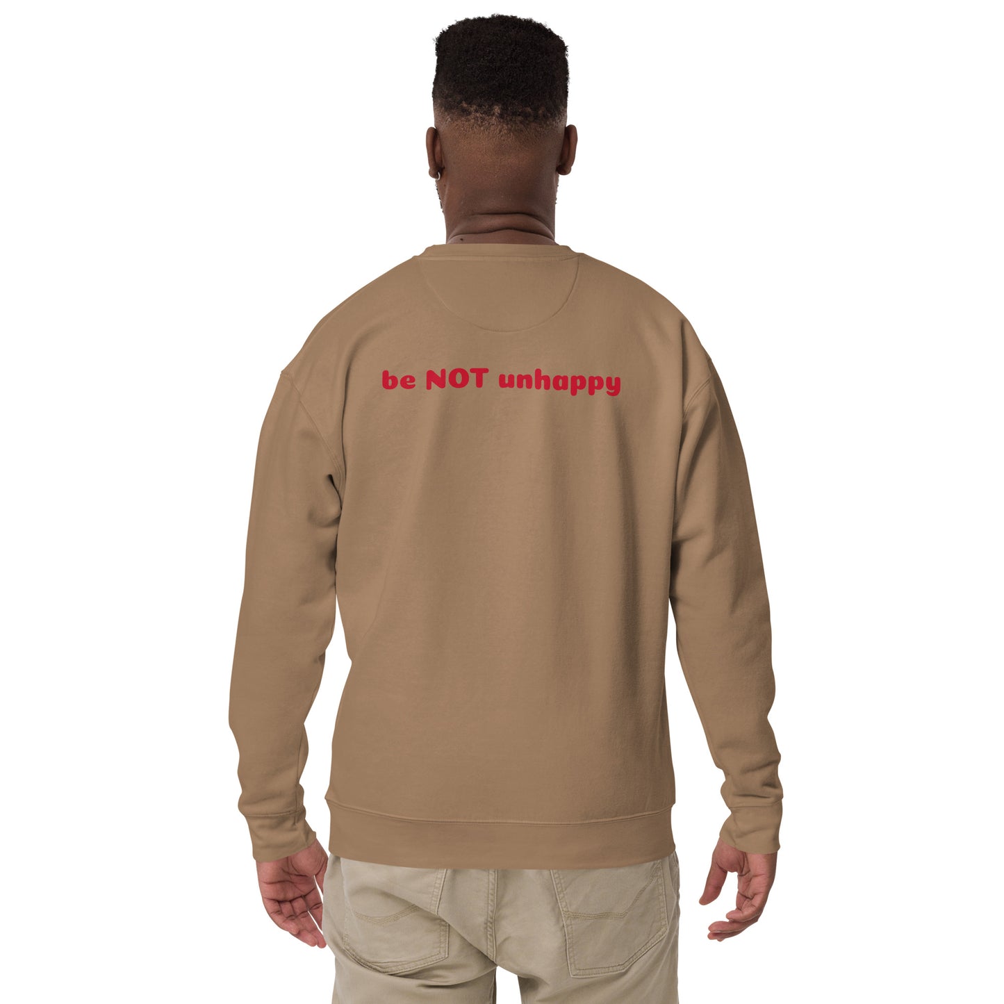 Person wearing a latte sweatshirt with 'be NOT unhappy' text on the back against a white background