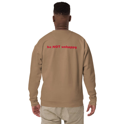 Person wearing a latte sweatshirt with 'be NOT unhappy' text on the back against a white background