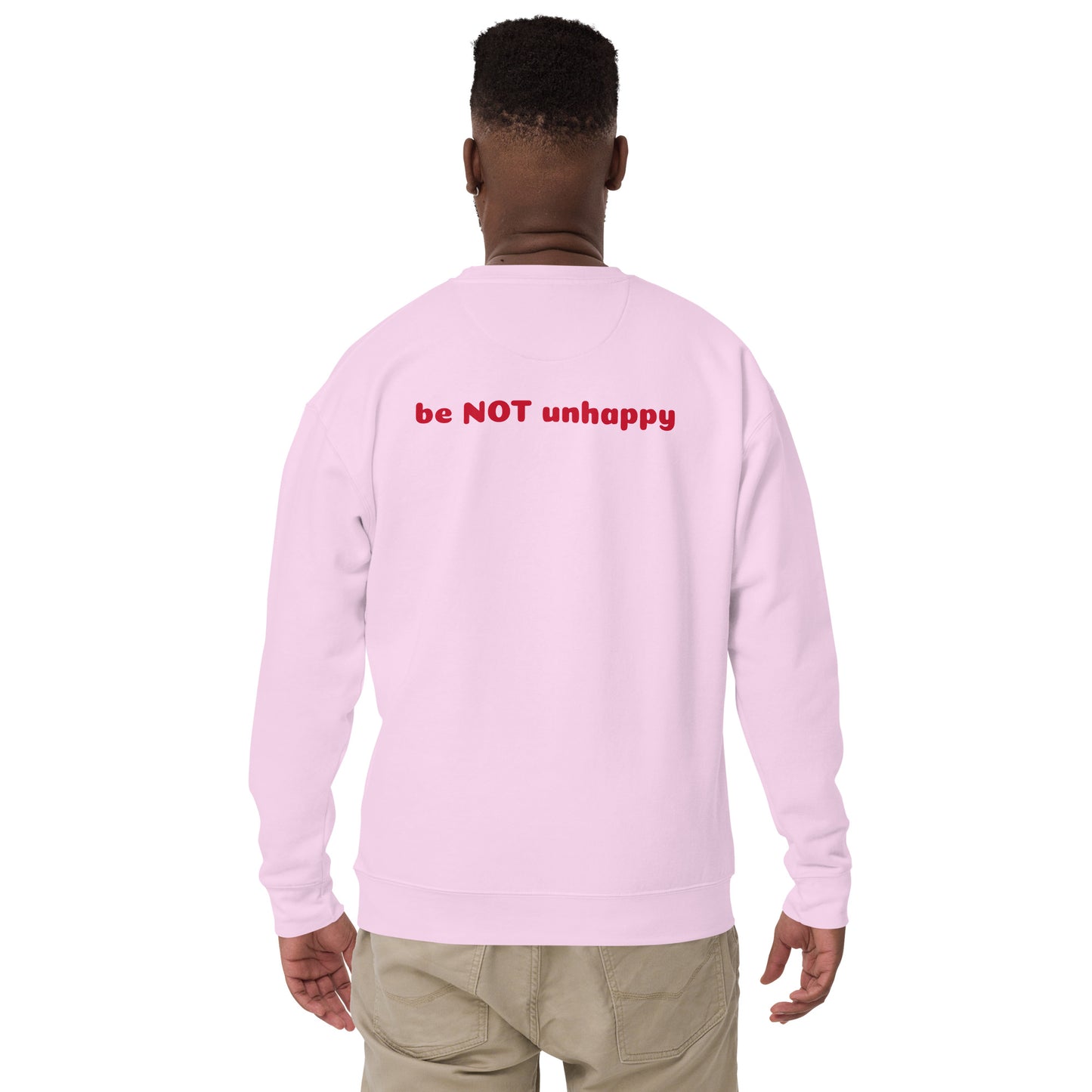 Person wearing a lavender long-sleeve shirt with 'be NOT unhappy' text on the back, standing against a white background.