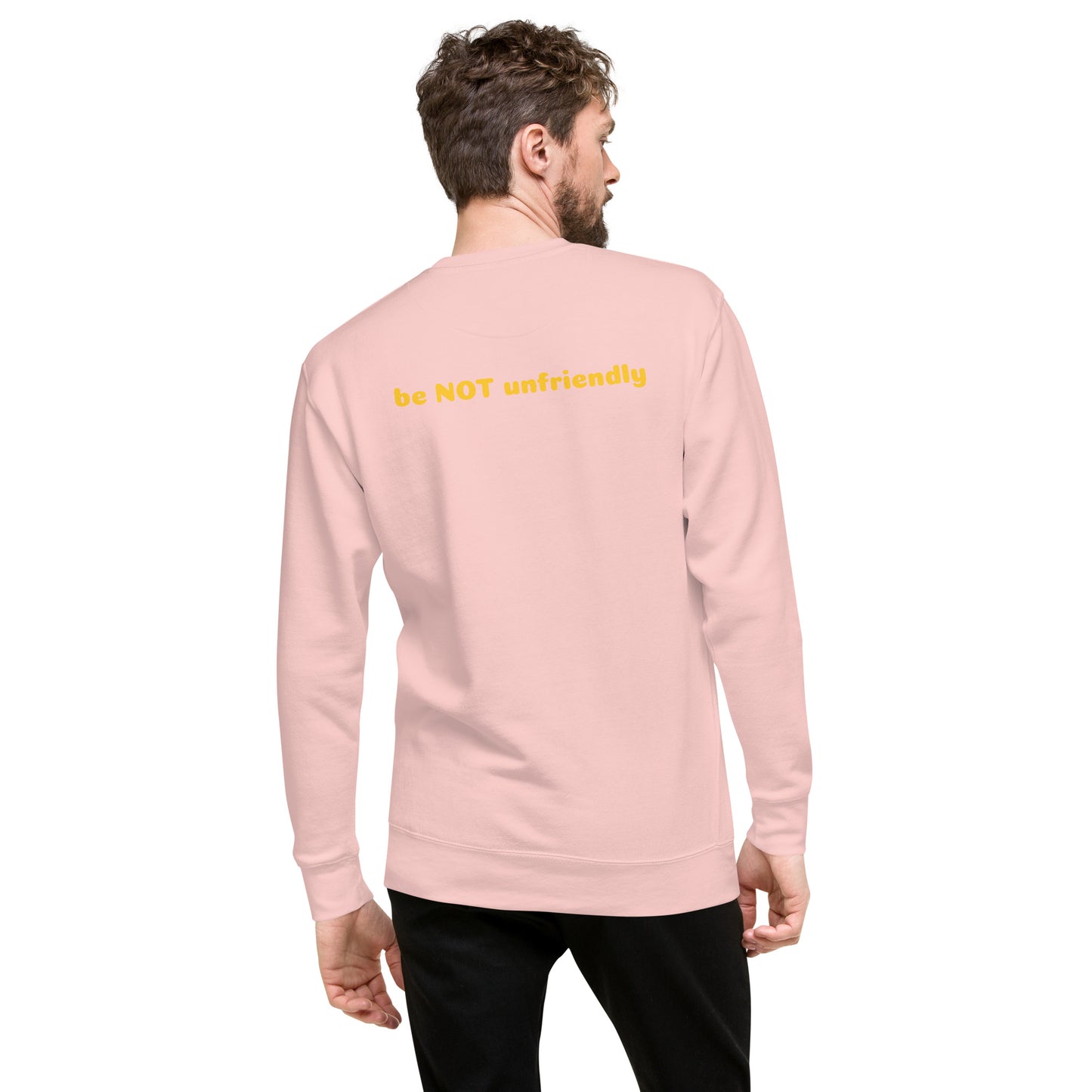 Man wearing a light pink long-sleeve shirt on a white background