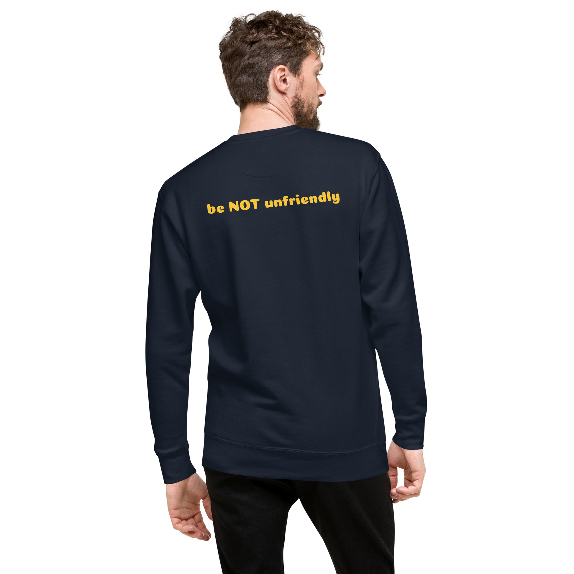 Person wearing a navy sweatshirt with 'be NOT unfriendly' text on the back, on a white background