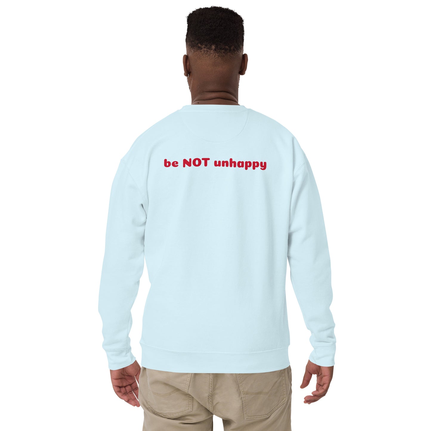 Sky blue long-sleeve shirt with 'be NOT unhappy' text on the back, worn by a person.