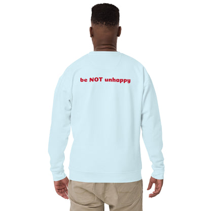Sky blue long-sleeve shirt with 'be NOT unhappy' text on the back, worn by a person.