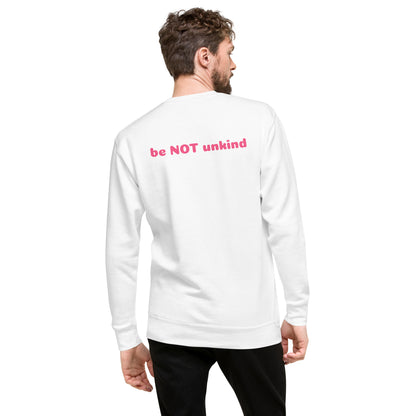 Man wearing a white long-sleeve shirt with pink text on the back, standing against a white background.